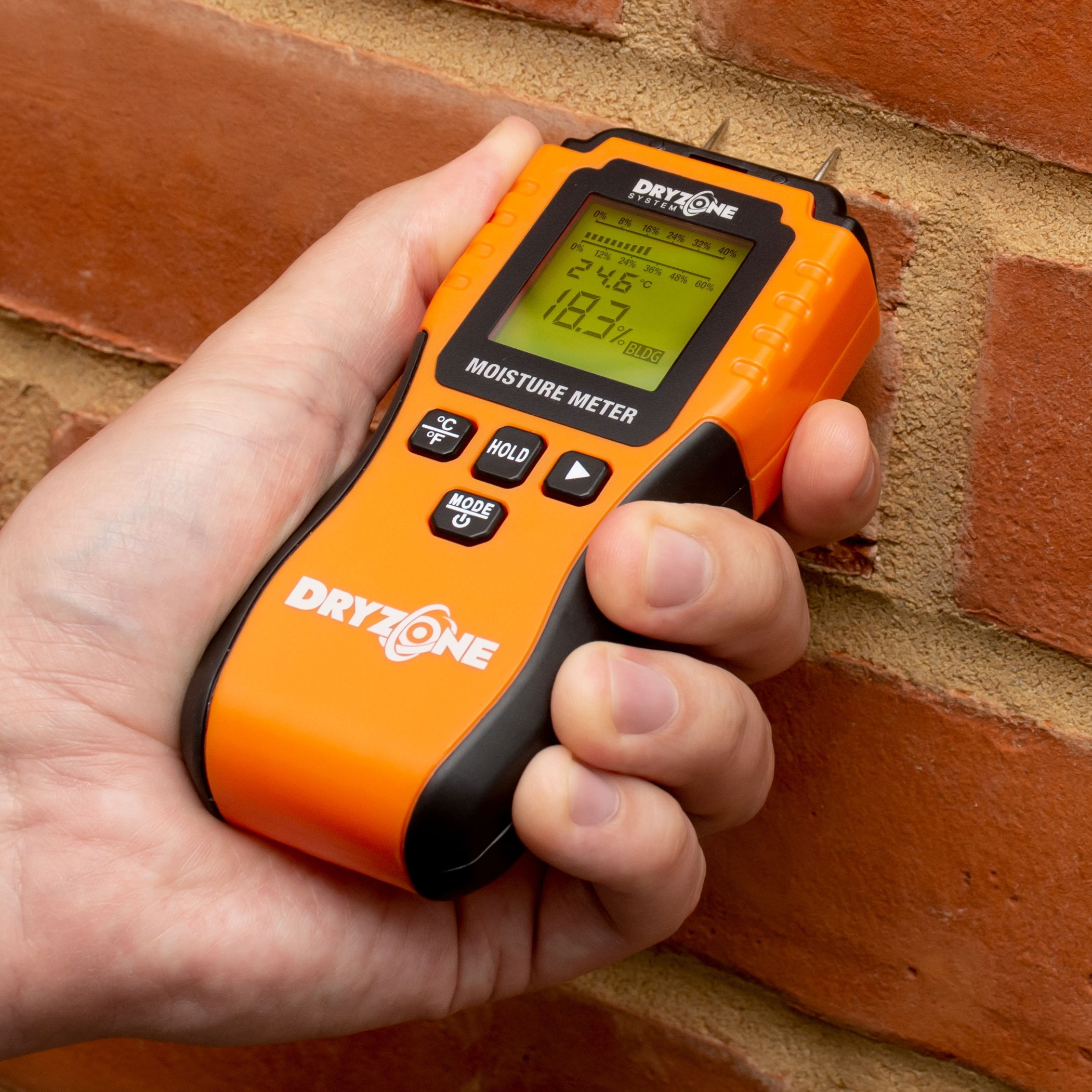 Dryzone Moisture Meter on a brick wall.