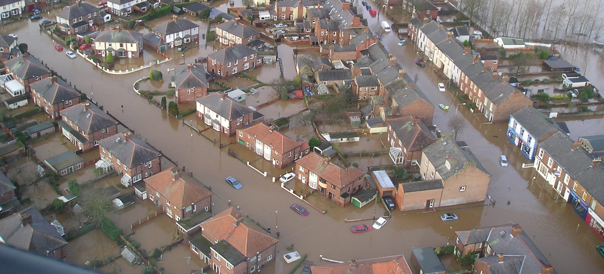 A bird's eye view of a flooded building estate.