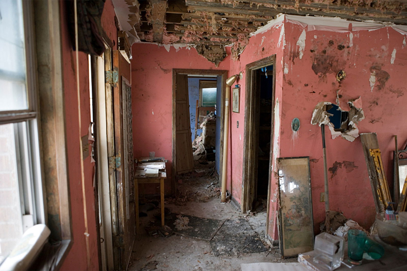 Severe flood damage to the interior of a home.