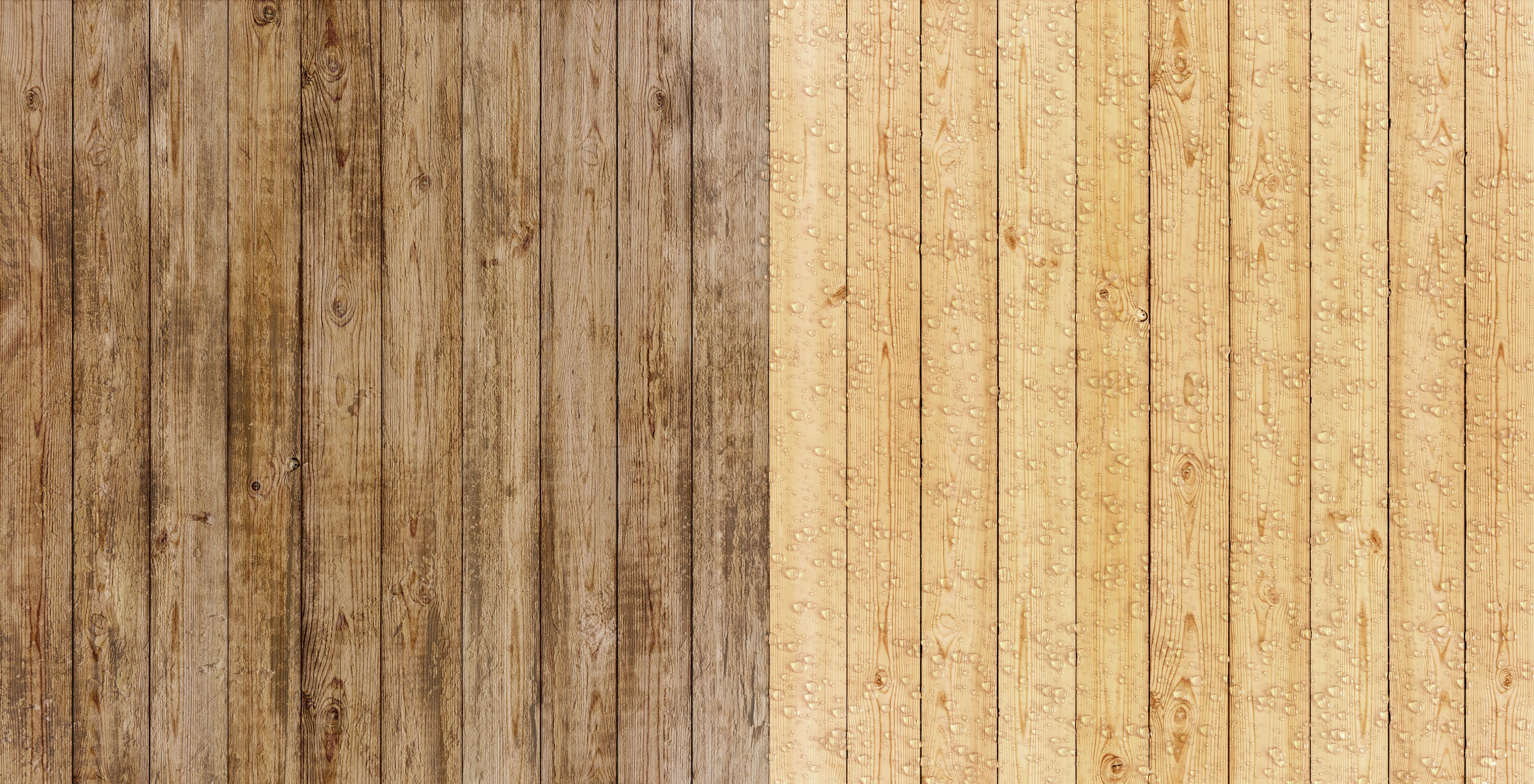 Rain beads on a wooden fence.