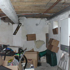 A basement with boxes inside, before conversion.