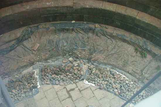 The inside of a dock with stone.