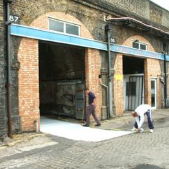 Waterproofing works on a railway arch.