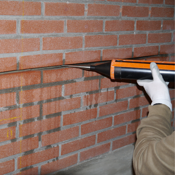 Injecting the bead of BrickFix Helical Grout