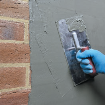 Drybase Tanking Slurry smoothing with a trowel